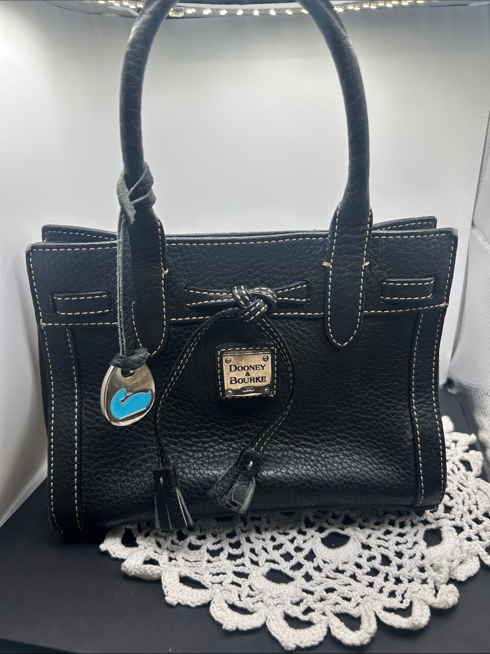 Dooney & Bourke small Black Leather Satchel with Turquoise Charm  9” x6.5”